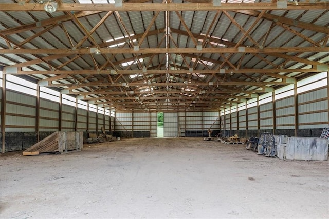 miscellaneous room featuring concrete flooring and vaulted ceiling