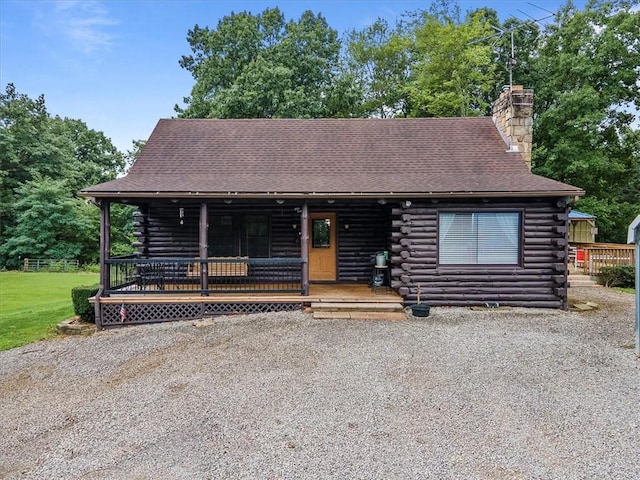 log home with covered porch