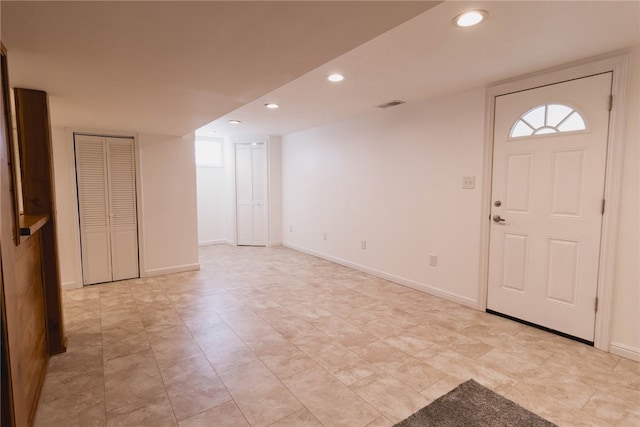 entrance foyer featuring light tile patterned floors