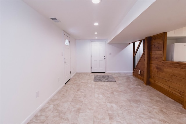 basement with light tile patterned floors