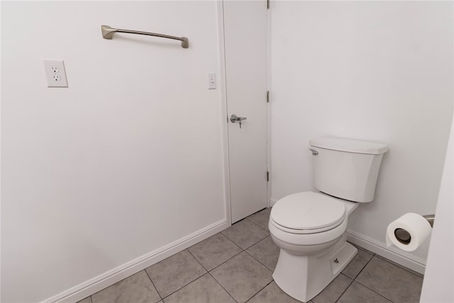 bathroom with tile patterned floors and toilet