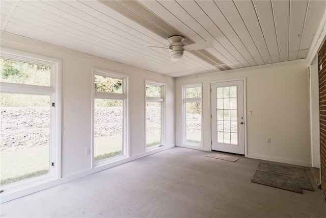 unfurnished sunroom with ceiling fan and wood ceiling