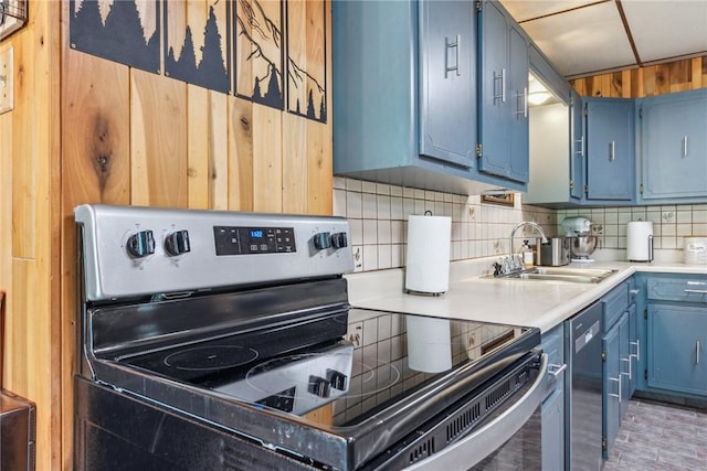 186 Lake Road Ln, Middlecreek Twp, PA 15557 - kitchen with blue cabinets, a sink, light countertops, appliances with stainless steel finishes, and backsplash