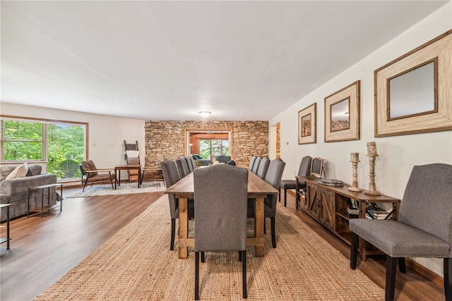 dining room with light hardwood / wood-style flooring and a wealth of natural light