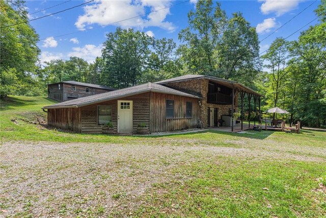 186 Lake Road Ln, Middlecreek Twp, PA 15557 - rear view of house with a lawn and a patio