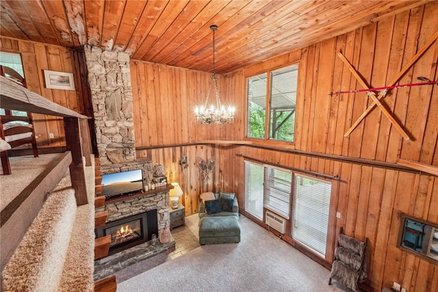 186 Lake Road Ln, Middlecreek Twp, PA 15557 - sitting room featuring wood walls, wood ceiling, a fireplace, and an inviting chandelier
