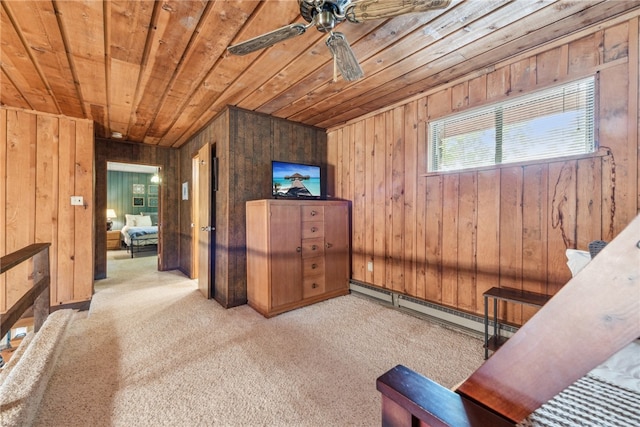 interior space featuring wood walls, wood ceiling, light colored carpet, and baseboard heating