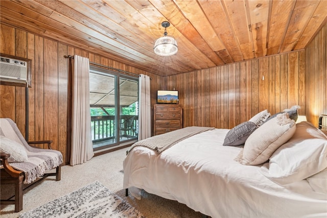 carpeted bedroom with wood walls, access to exterior, and wood ceiling