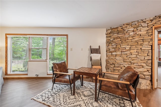 sitting room featuring wood-type flooring