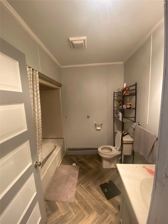 bathroom featuring vanity, parquet flooring, a bathtub, toilet, and baseboard heating