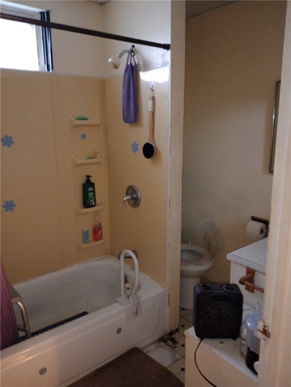 full bathroom featuring bathtub / shower combination, tile patterned floors, vanity, and toilet