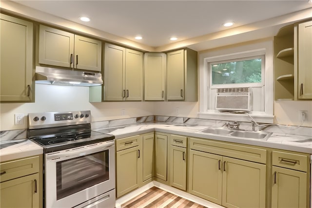 kitchen featuring stainless steel electric stove, cooling unit, sink, and light hardwood / wood-style floors