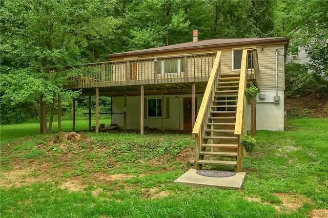 exterior space with a yard and a wooden deck