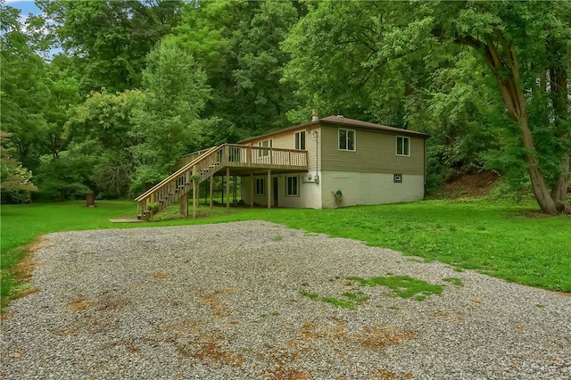 exterior space with a front yard and a deck