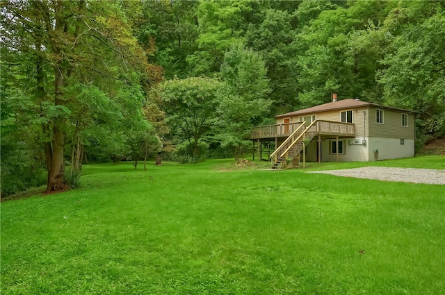 view of yard featuring a wooden deck