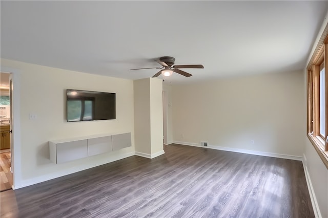 unfurnished living room featuring ceiling fan and wood-type flooring