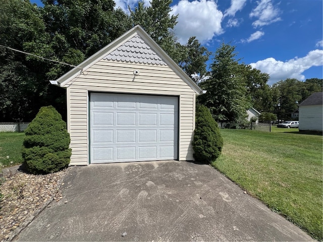 garage featuring a lawn