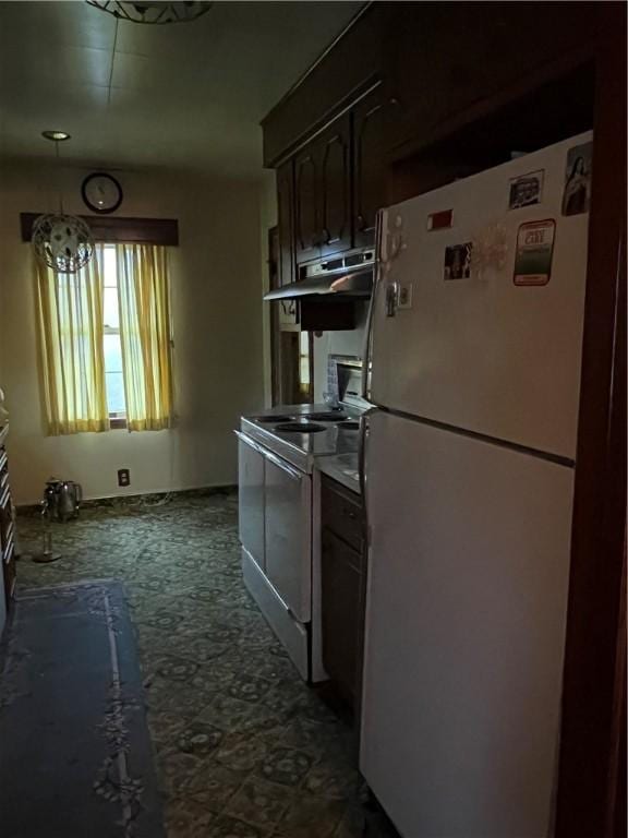 kitchen featuring dark brown cabinetry, stainless steel electric range oven, and white refrigerator