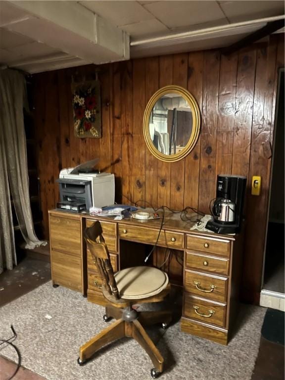 carpeted office with wood walls