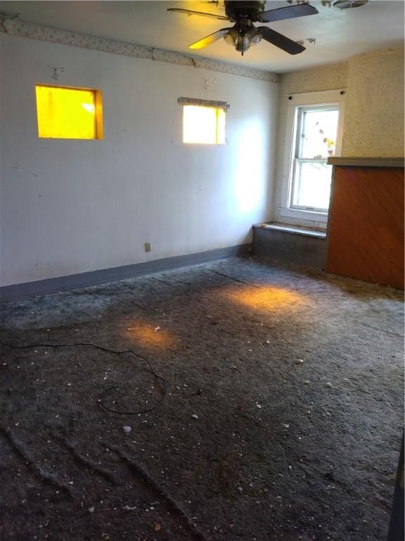 unfurnished room featuring ceiling fan