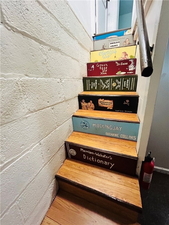 stairway featuring hardwood / wood-style flooring