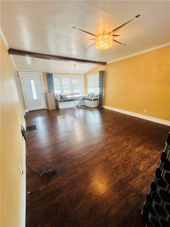 unfurnished living room featuring beamed ceiling, dark hardwood / wood-style floors, and ceiling fan