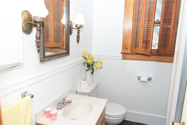 bathroom featuring vanity and toilet