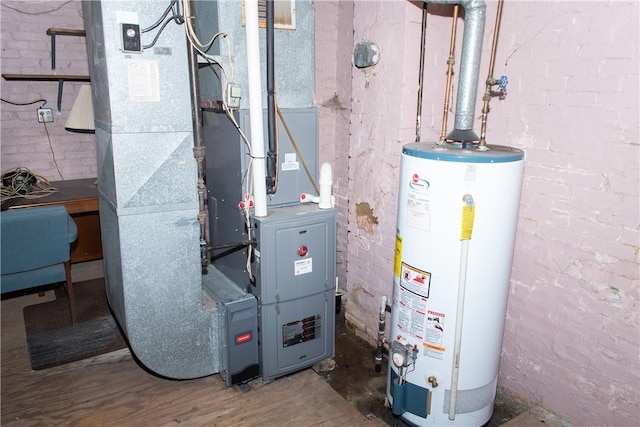 utility room with heating unit and water heater