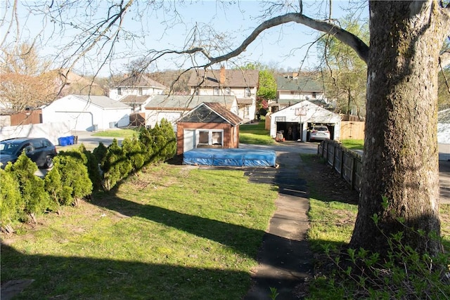 view of yard with an outbuilding and a garage