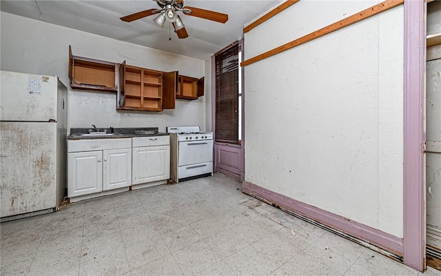 kitchen with white appliances, ceiling fan, and sink