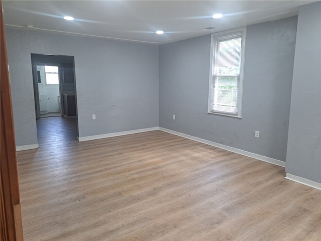 empty room with light hardwood / wood-style floors