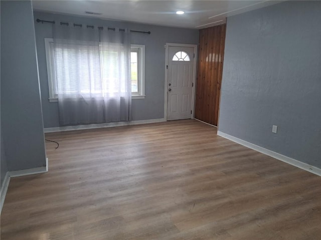 entryway with wood-type flooring