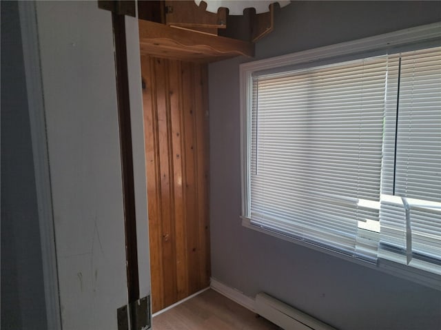 interior space featuring hardwood / wood-style flooring and a baseboard radiator