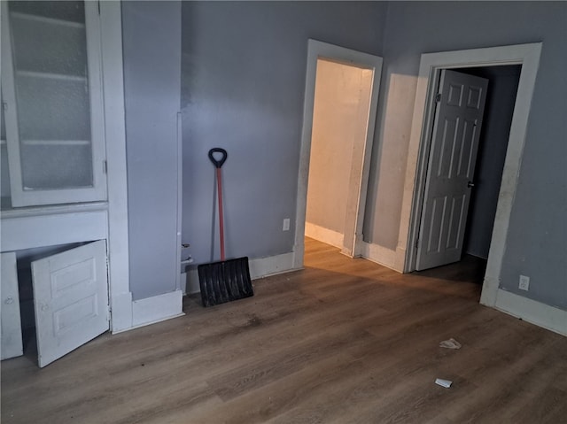 unfurnished living room with wood-type flooring