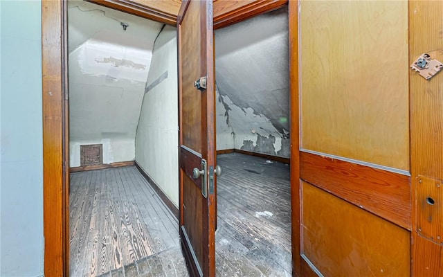 hallway with dark wood-type flooring