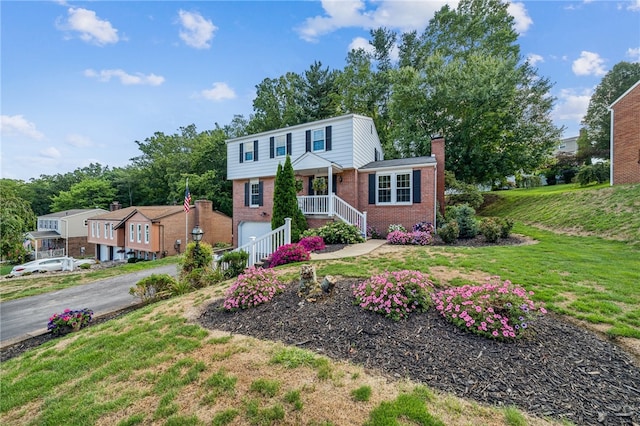 view of front of home featuring a front yard and covered porch