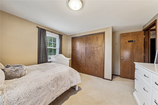 carpeted bedroom featuring a closet