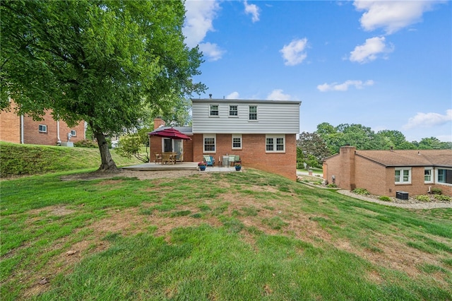 rear view of property featuring central AC, a lawn, and a patio