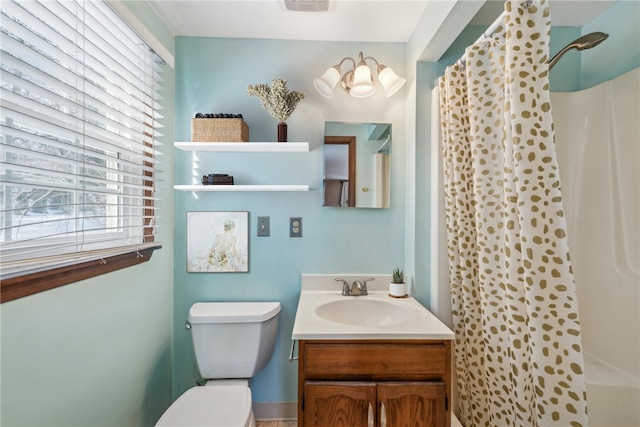 bathroom with vanity, a shower with curtain, and toilet