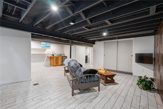 3326 New England Rd, West Mifflin, PA 15122 - basement featuring bar area, wood finished floors, and baseboards
