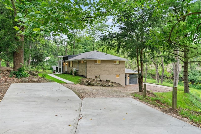 3326 New England Rd, West Mifflin, PA 15122 - view of home's exterior with brick siding and view of scattered trees
