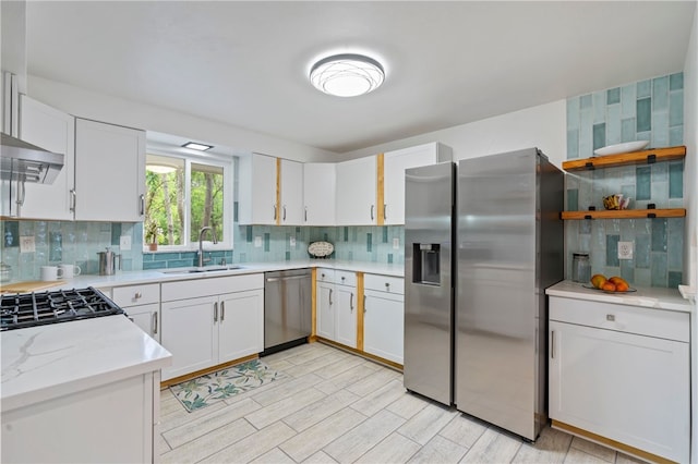3326 New England Rd, West Mifflin, PA 15122 - kitchen featuring appliances with stainless steel finishes, a sink, tasteful backsplash, and white cabinetry