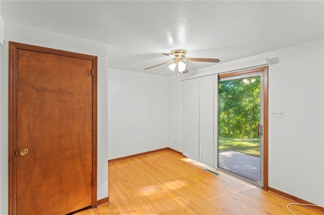 unfurnished room with ceiling fan and light hardwood / wood-style floors