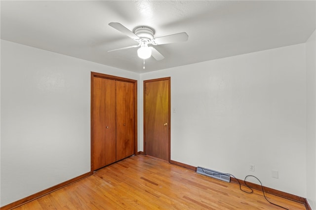 interior space with ceiling fan and light hardwood / wood-style flooring