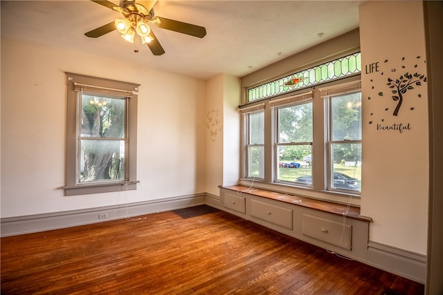 empty room with ceiling fan and hardwood / wood-style floors