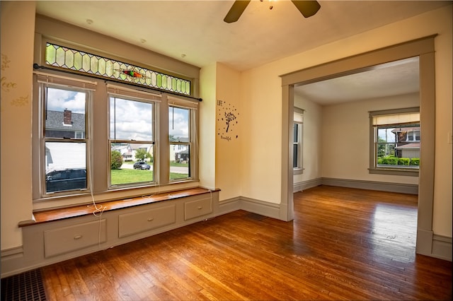 unfurnished room featuring ceiling fan and hardwood / wood-style flooring