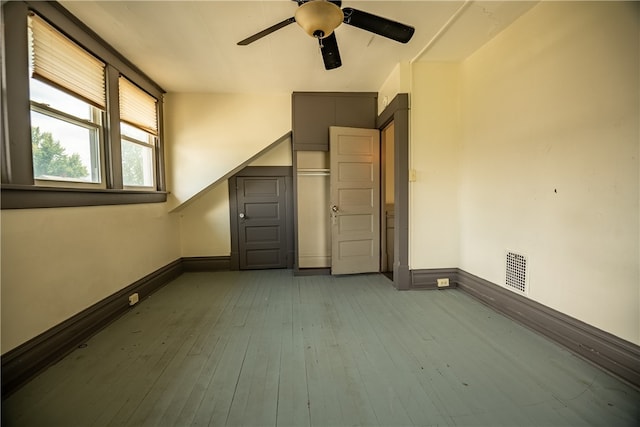 empty room featuring hardwood / wood-style floors and ceiling fan