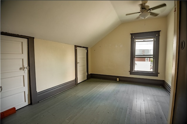 bonus room with ceiling fan, wood-type flooring, and vaulted ceiling