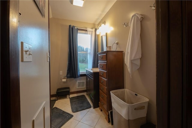 bathroom featuring tile patterned floors and vanity