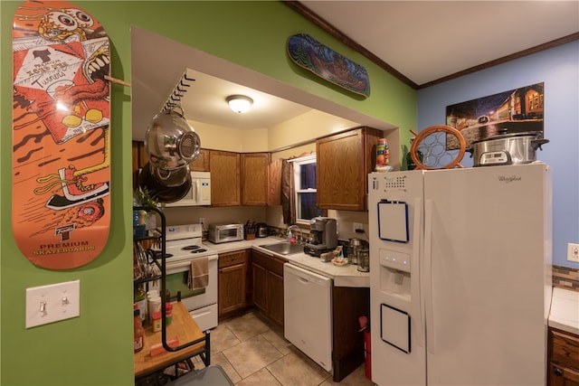 kitchen featuring light tile patterned flooring, crown molding, white appliances, and sink